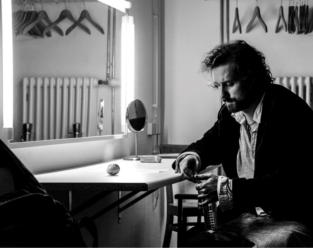 Man at vanity dressing room table
