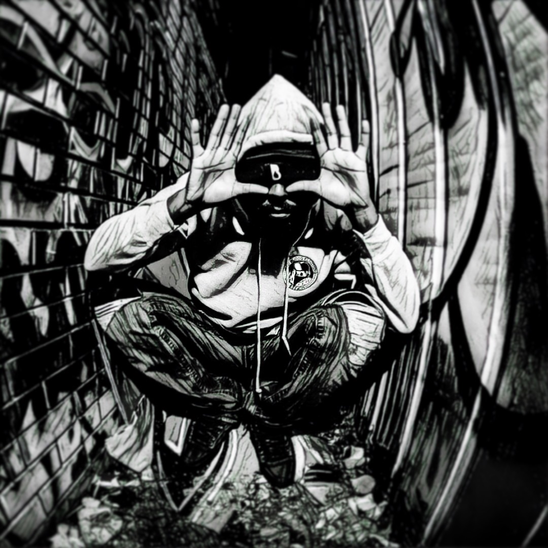 Figure in hoodie, graffiti alley