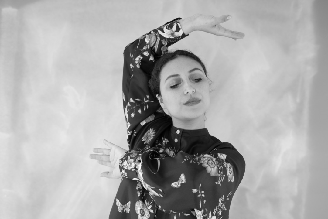 Dancer, floral dress, expressive pose