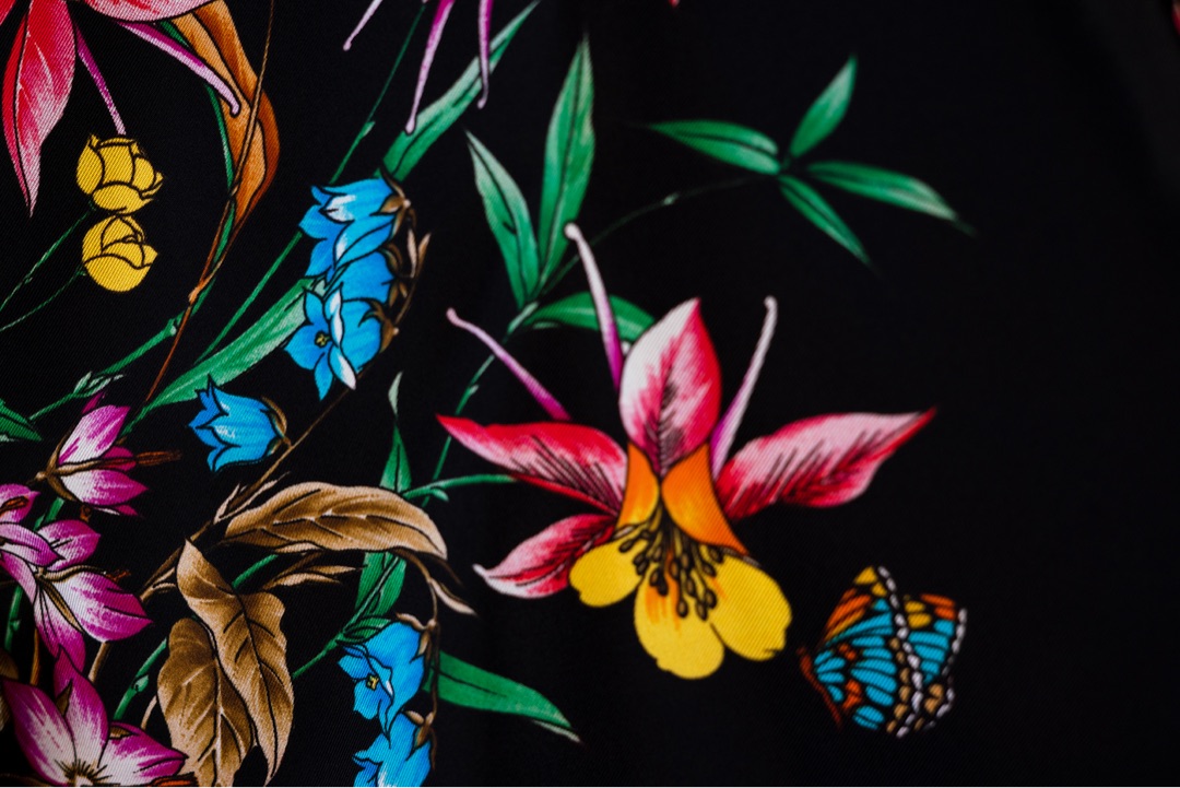 Vivid floral textile detail, black background