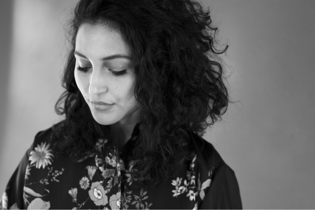 Portrait, curly hair, floral blouse